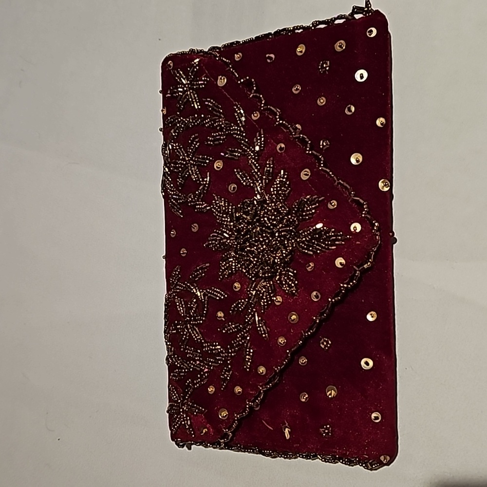 Handmade clutch in burgundy velvet with beads and sequin work.
